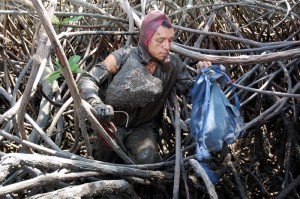 4-crabber-in-mud-3-medium A crab collector—one of 150,000 Ecuadorians who rely on mangroves for their livelihood.