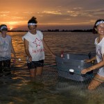 Checking the net at sunset.