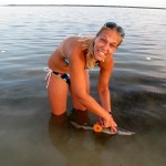 holly-1-medium Shark census volunteer Hollie Neibert with a lemon shark she has just removed from the net.